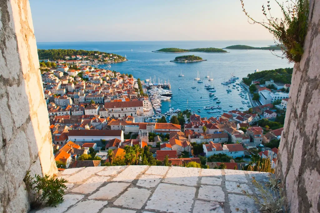 Croatia adventure tours, panoramic photo of Hvar, town at sunset